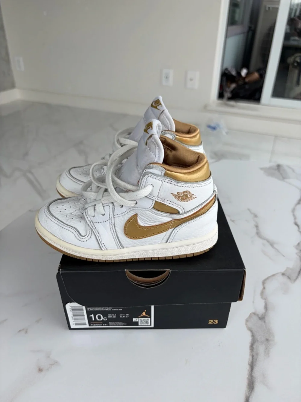 Nike Kids White and Tan High-Top Sneakers with Gold Logo Accent - Picture 2 of 5